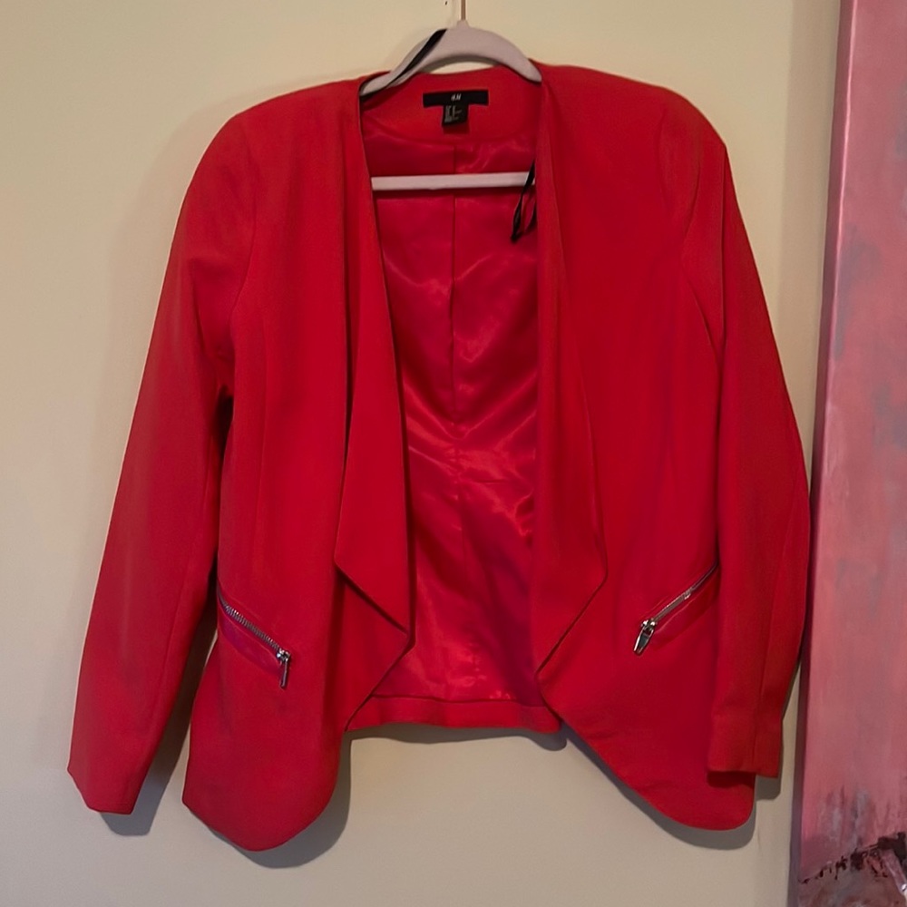 Orange blazer in large with zipper on sides